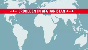 Grafik von Weltkarte mit Schriftbanner "Erdbeben in Afghanistan"