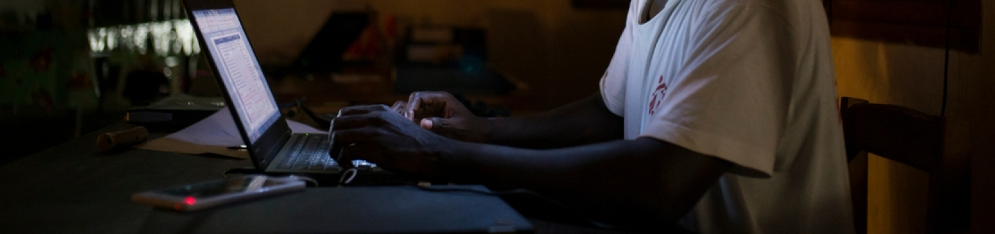 Jean Liyolongo, Head of Monga Intervention, works late into the night at the MSF base, Monga, in Bas-Uele Province, Democratic Republic of Congo.