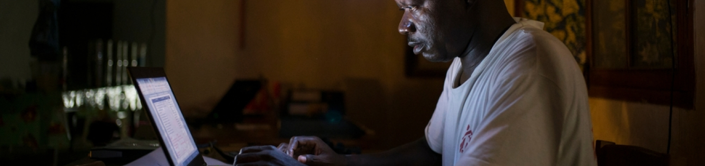 Jean Liyolongo, Head of Monga Intervention, works late into the night at the MSF base, Monga, in Bas-Uele Province, Democratic Republic of Congo. Jean Liyolongo, Head of Monga Intervention, works late into the night at the MSF base, Monga, in Bas-Uele Province, Democratic Republic of Congo.