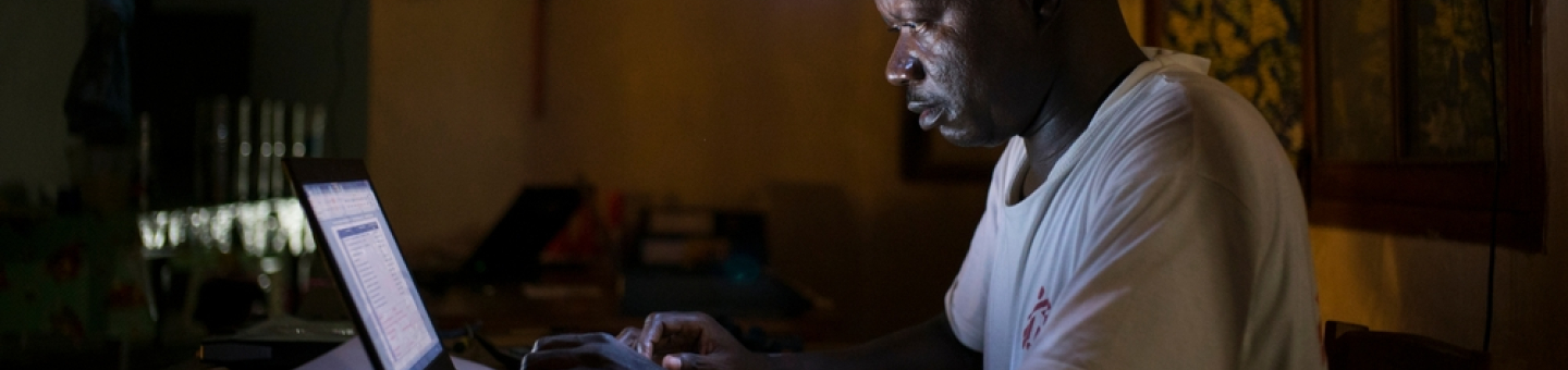 Jean Liyolongo, Head of Monga Intervention, works late into the night at the MSF base, Monga, in Bas-Uele Province, Democratic Republic of Congo.