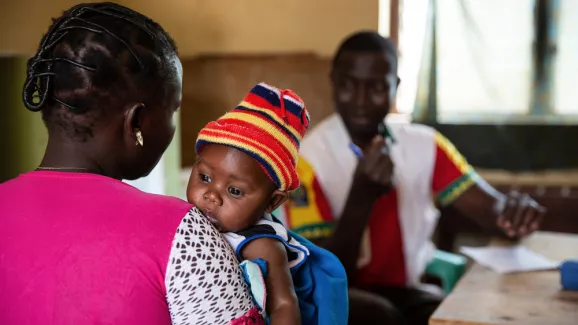 Baby Dondedieu (3 months old) with his mother Mireille (25) in consultation at the MSF supported medical center in Bezembe village. 

“For me measles is a new thing: I’ve heard about it this year for the first time, because we have many children getting sick in our villages. In fact, many people thought that it was a disease from the past, from the time of our ancestors, not something of nowadays” says Mireille.

Baby Dondedieu is the youngest of 4 boys, Mireille has to take care of them all alone. One 