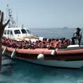 Aquarius is currently in the process of transferring 400 persons to two Italian Navy ships, at the request of the Italian MRCC. Aquarius was instructed by Maritime Rescue Coordination Centre in Rome to sail to Valencia to disembark the remaining 229 people.
 
While this appears to be a quick fix to the current political standoff, this should not set a precedent for future disembarkations. Rescued people should be disembarked in the nearest safe port available.