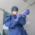 Mitarbeiterin zieht Covid-19-Schutzausrüstung an

 

In Lesbos MSF teams will operate an inpatient medical unit near Moria camp  for patients who present symptoms similar to COVID-19 and potential positive cases that might be detected. So far there is no confirmed case of COVID-19 in the camp of Moria but the aim of this centre is to facilitate the early detection of potential positive COVID-19 cases, the isolation, medical monitoring and treatment of those with mild symptoms. The early detection and is